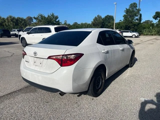 Used 2019 Super White Toyota LE image 2