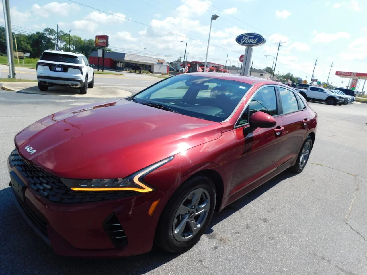 Used 2023 Burgundy Kia LXS AUTO FWD image 4