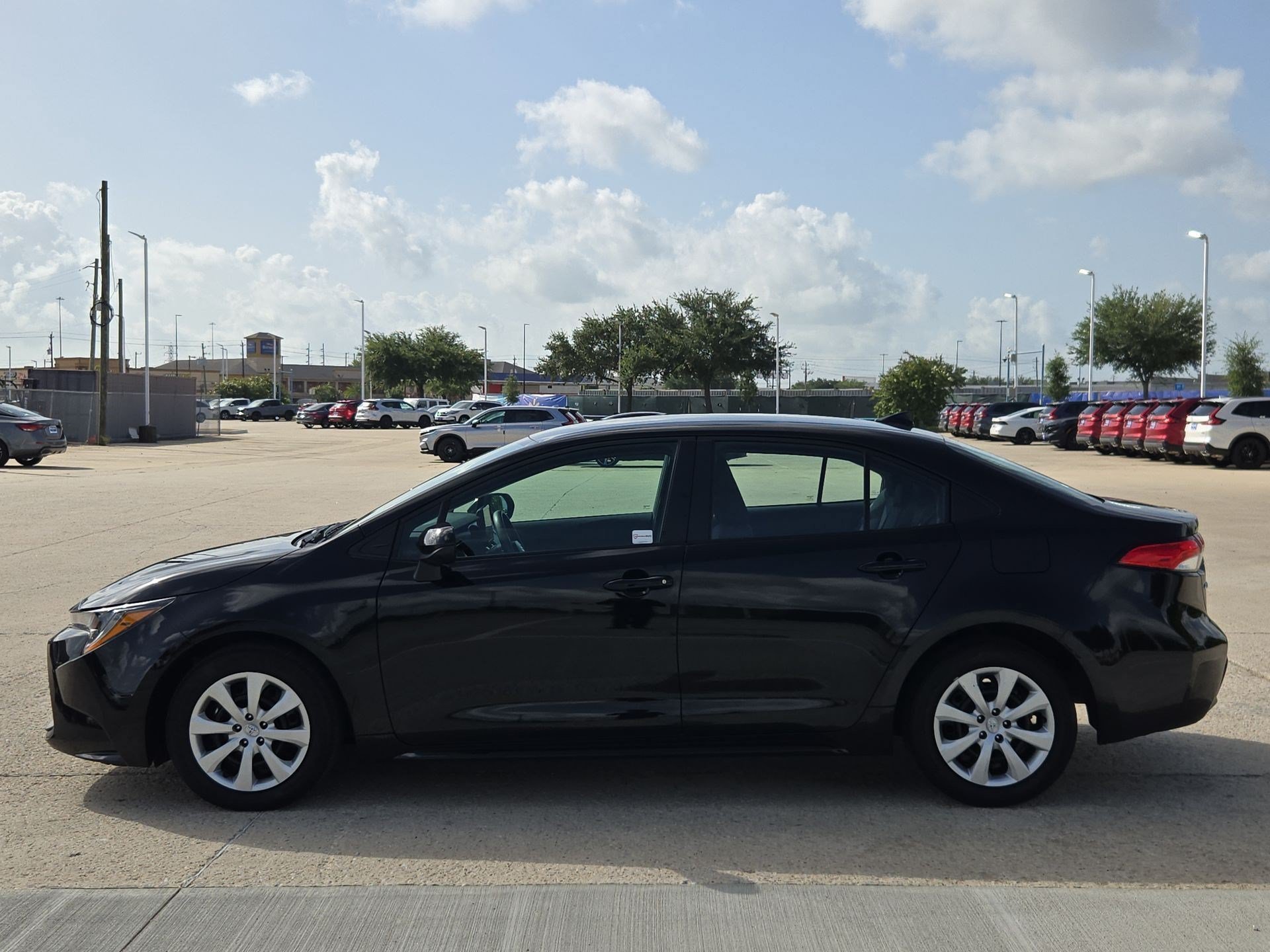 Used 2025 Midnight Black Metallic Toyota LE image 6