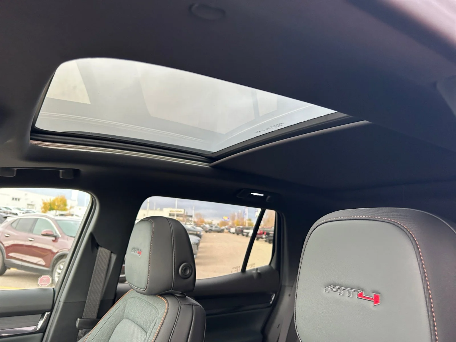 New 2026 Volcanic Red Tintcoat GMC AWD AT4 image 17