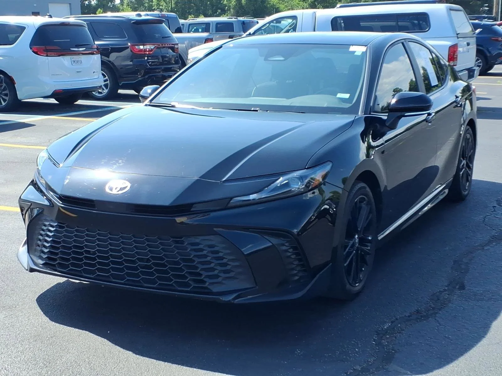 Used 2025 Midnight Black Metallic Toyota SE image 2