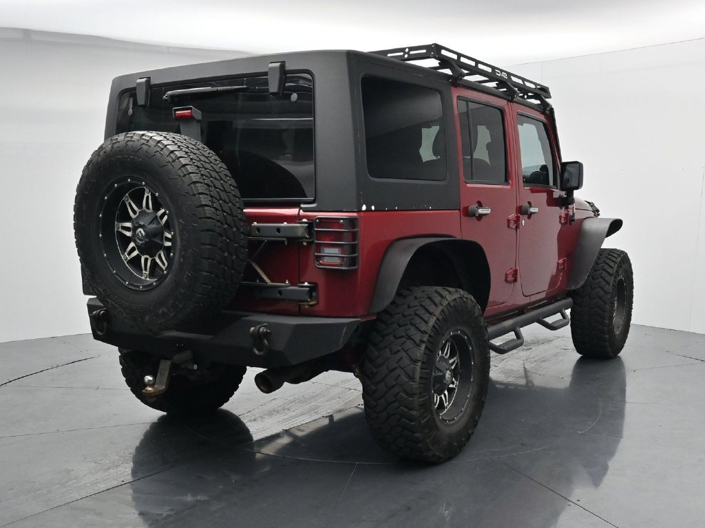 Used 2012 Red Jeep Unlimited Sport image 7
