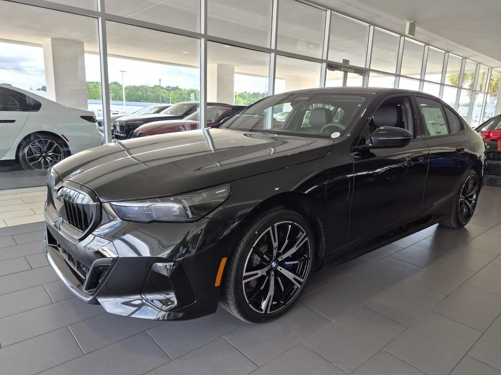 2027 BMW 5 Series 550e xDrive Sedan's photo
