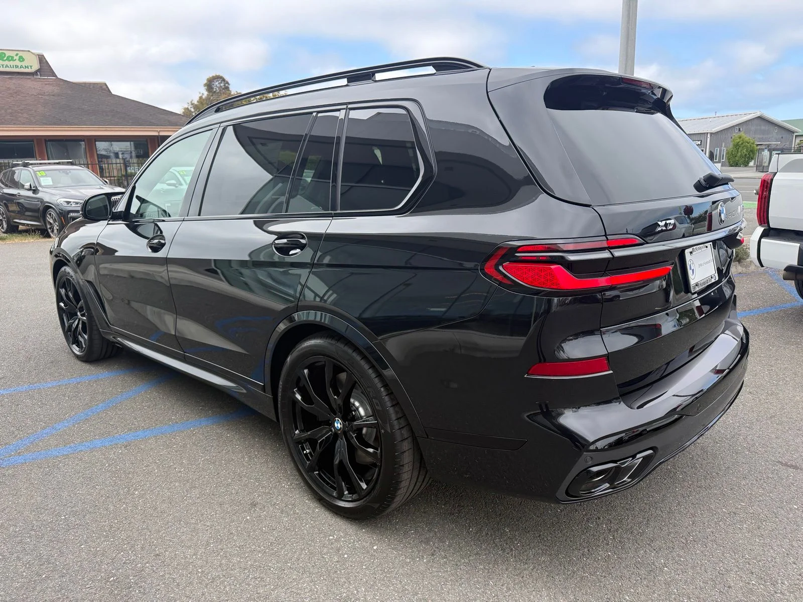 New 2027 Black Sapphire Metallic BMW M60i image 6