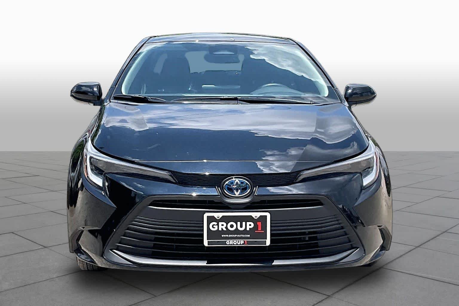 Used 2025 Midnight Black Metallic Toyota Hybrid LE image 4