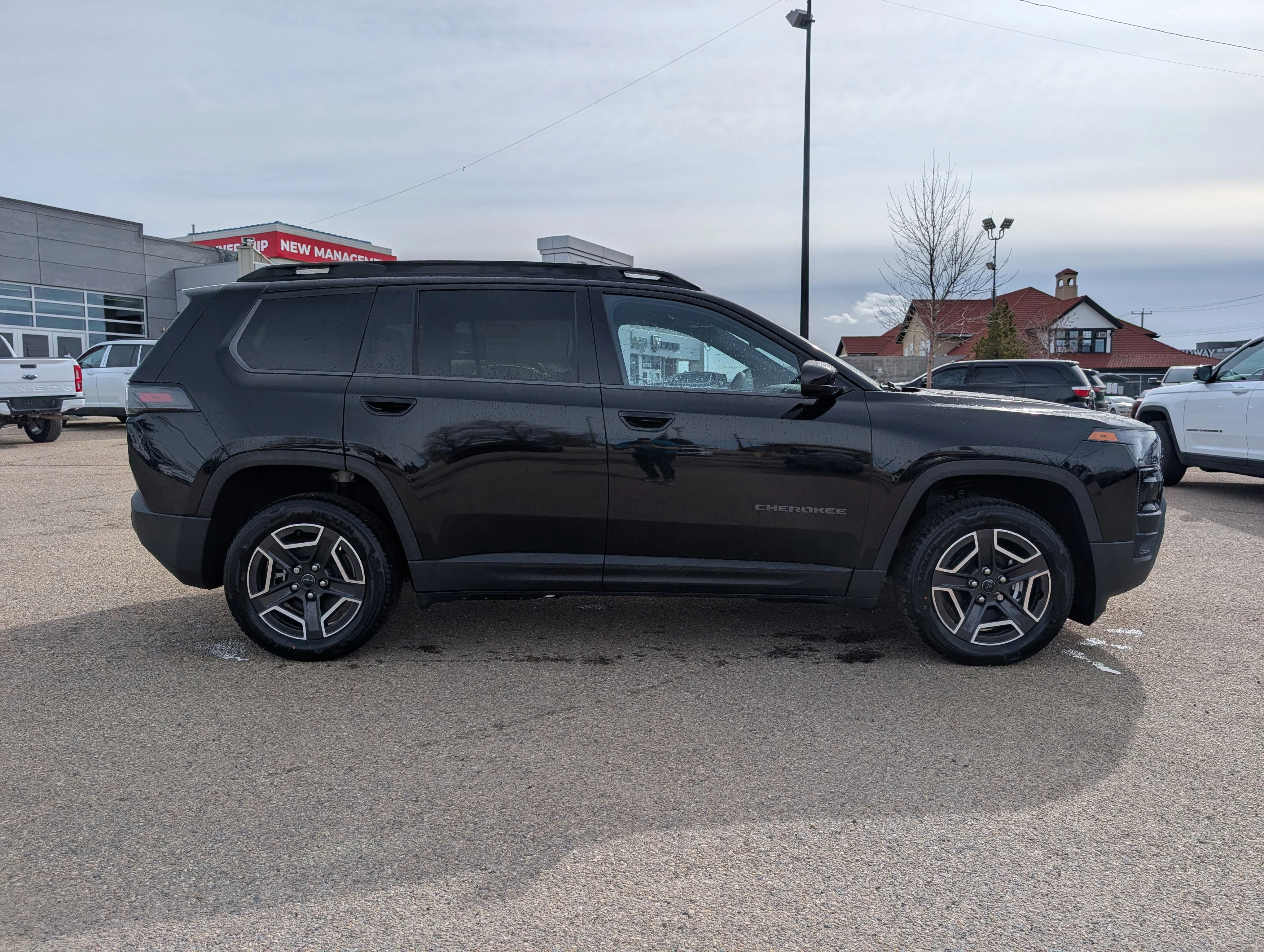 New 2026 Diamond Black Crystal Pearl Jeep Laredo image 8