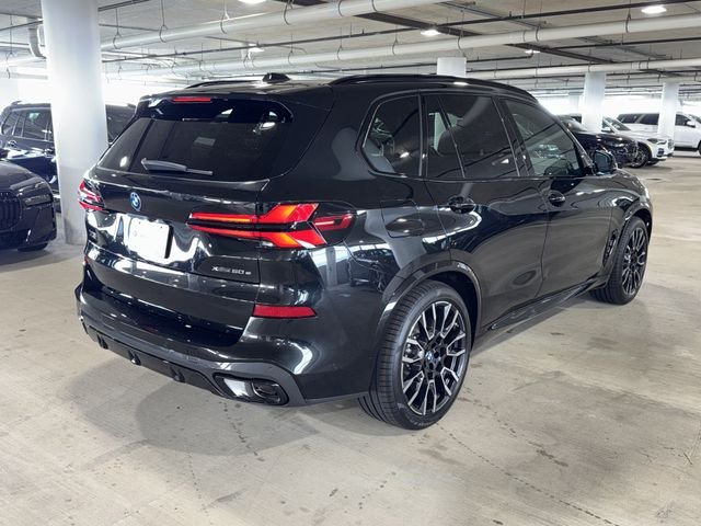 New 2026 Black Sapphire Metallic BMW xDrive50e image 7