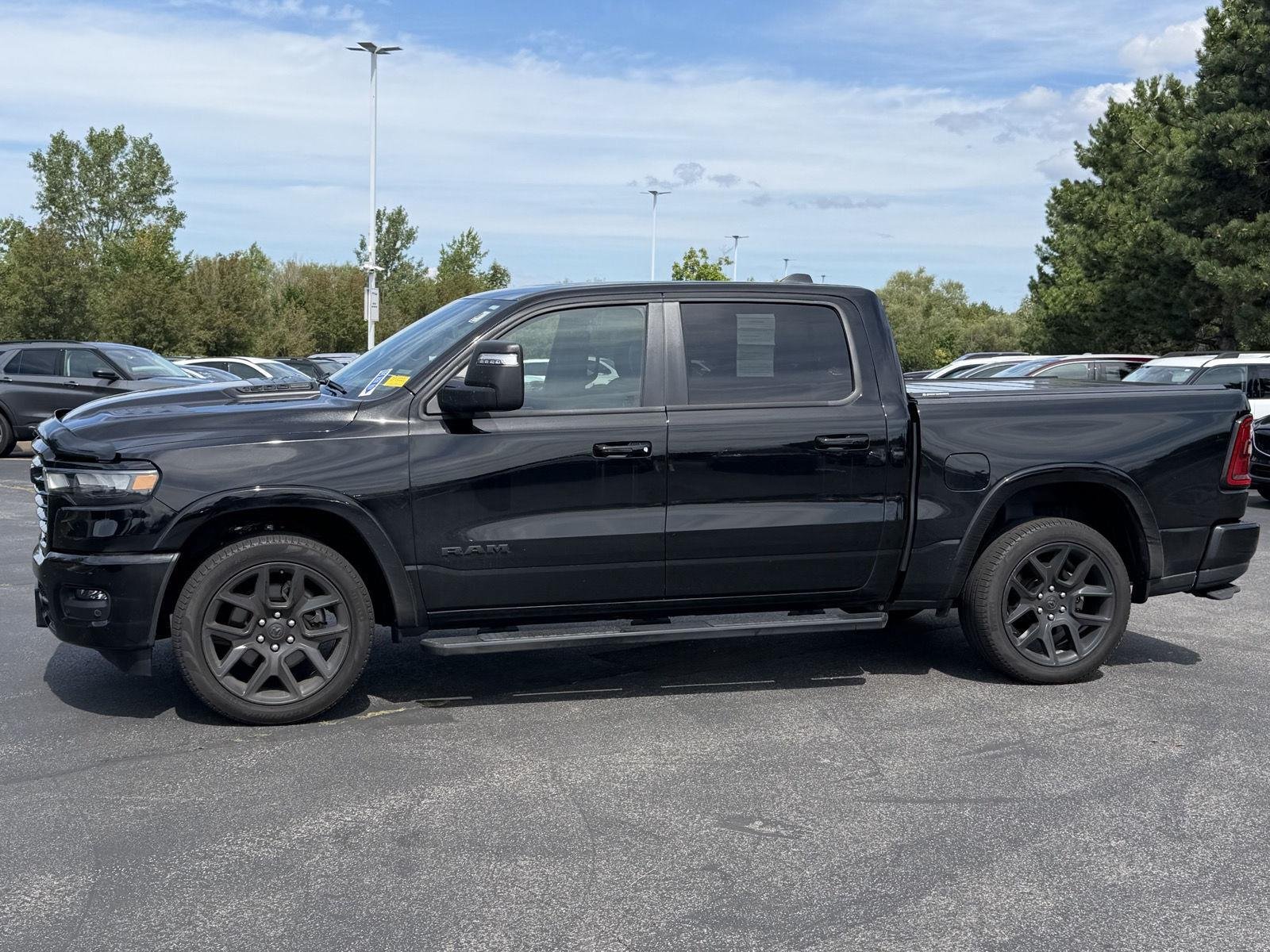 Used 2025 Diamond Black Crystal Pearlcoat Ram Laramie image 6
