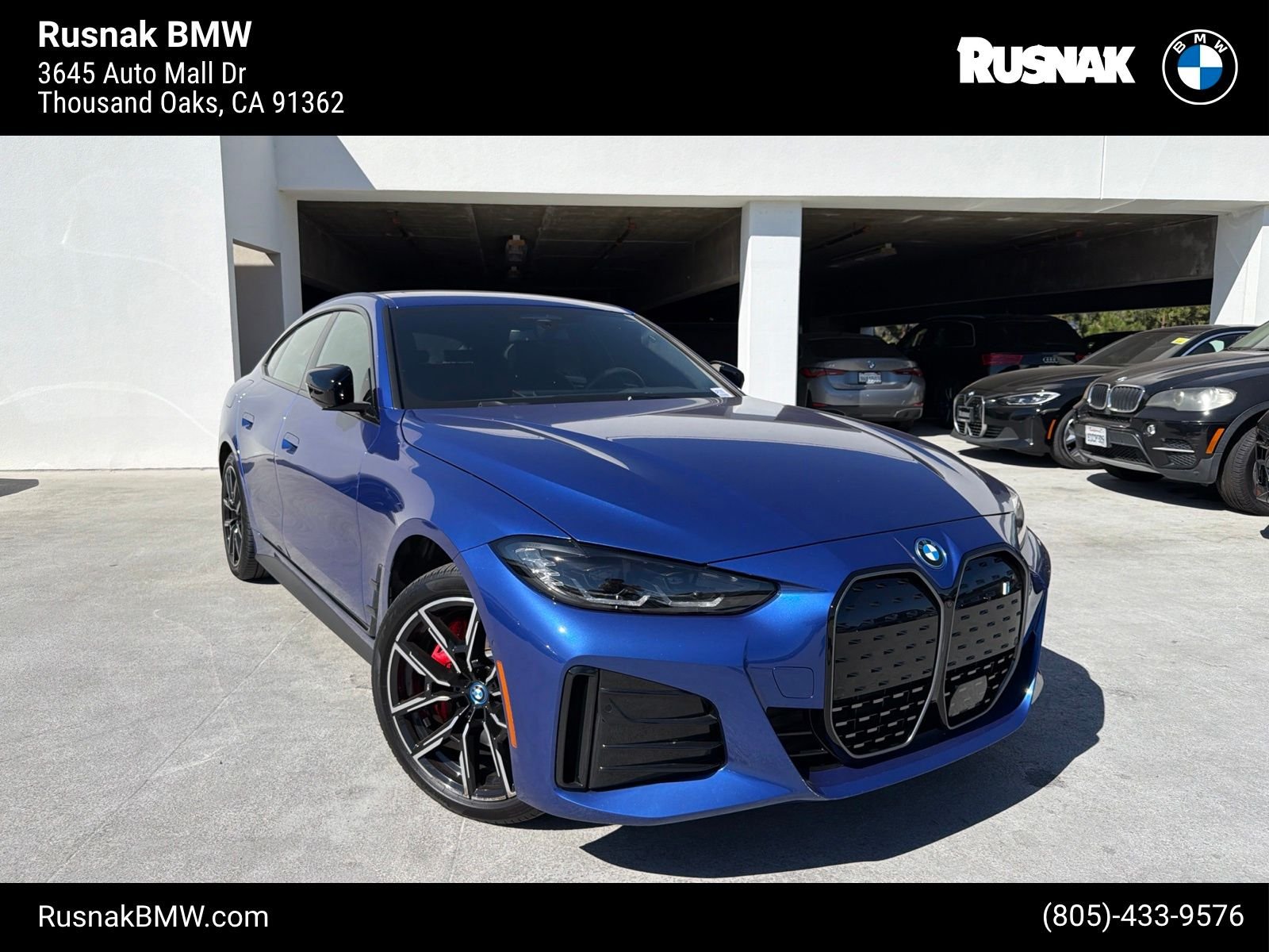 Certified Used 2023 Portimao Blue Metallic BMW eDrive40 image 1