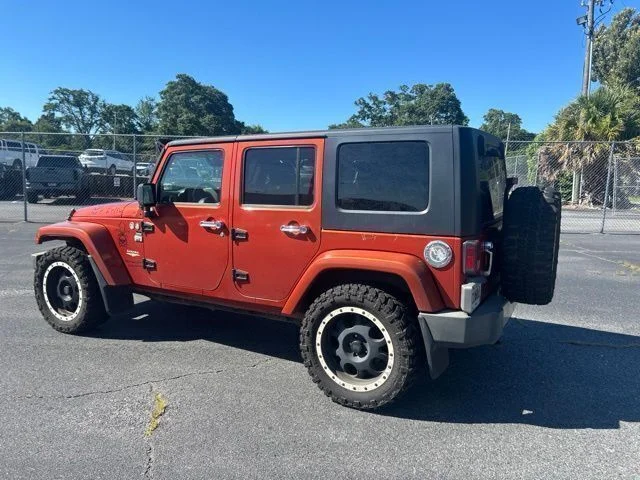 Used 2009 Orange Jeep Unlimited Sahara image 3