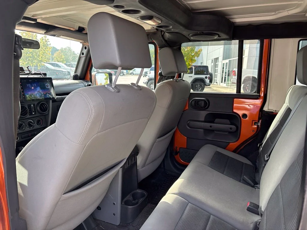 Used 2010 Orange Jeep Unlimited Sport image 9