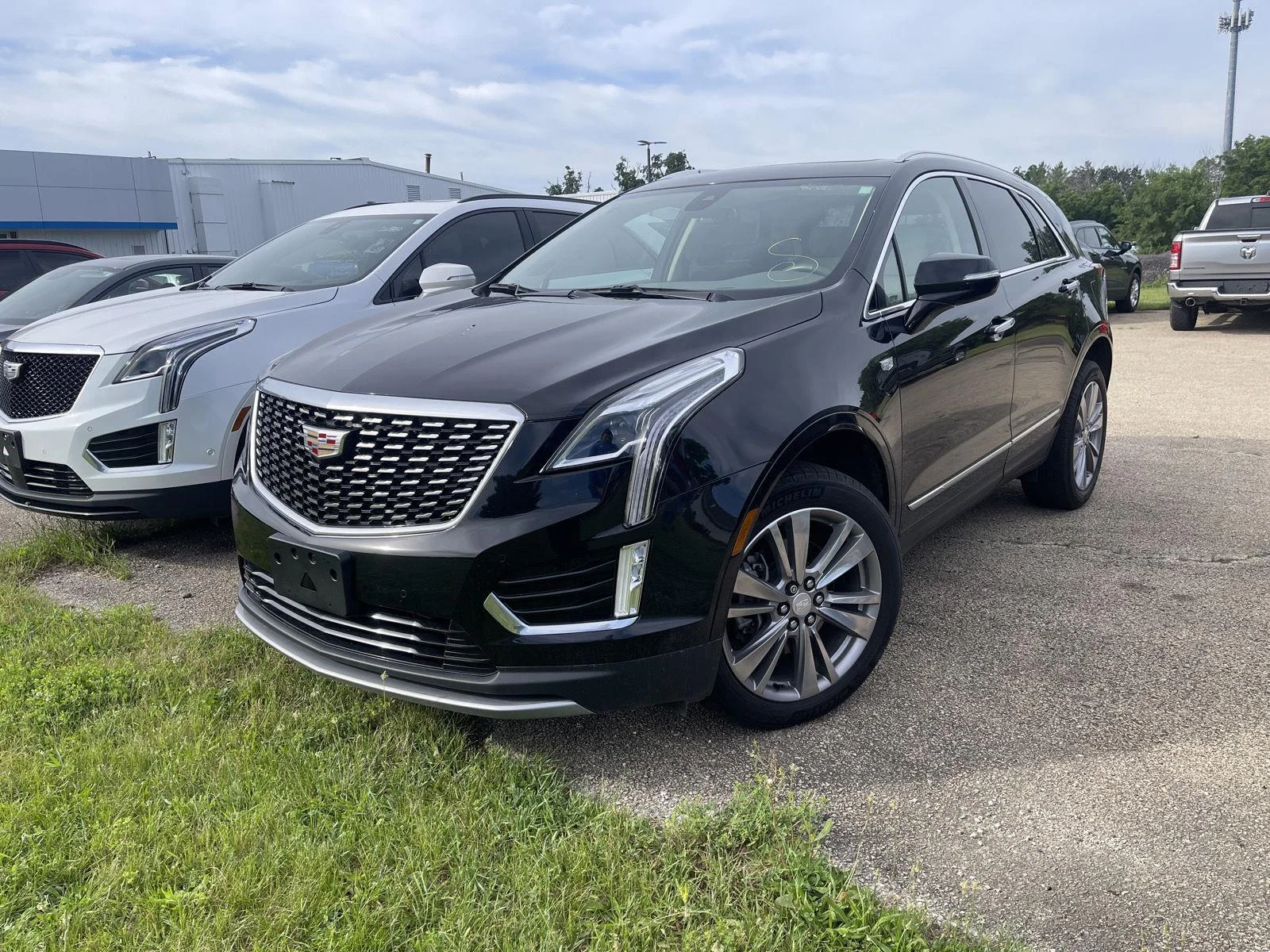 Used 2024 Stellar Black Metallic Cadillac AWD Premium Luxury image 1