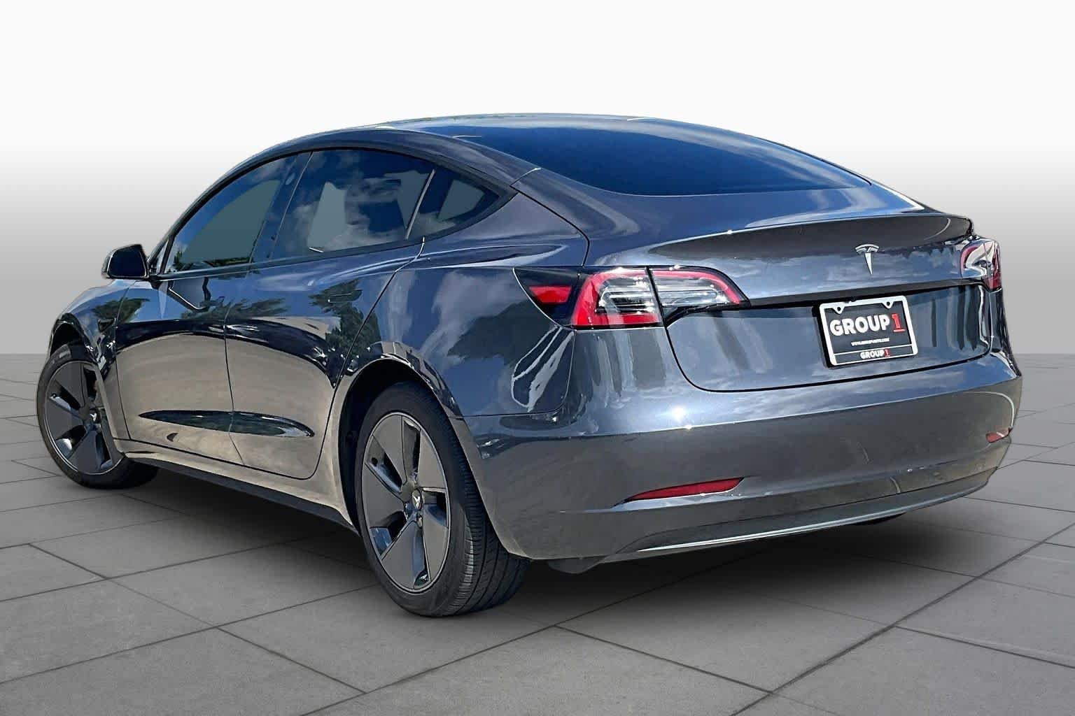 Used 2023 Solid Black Tesla  image 9