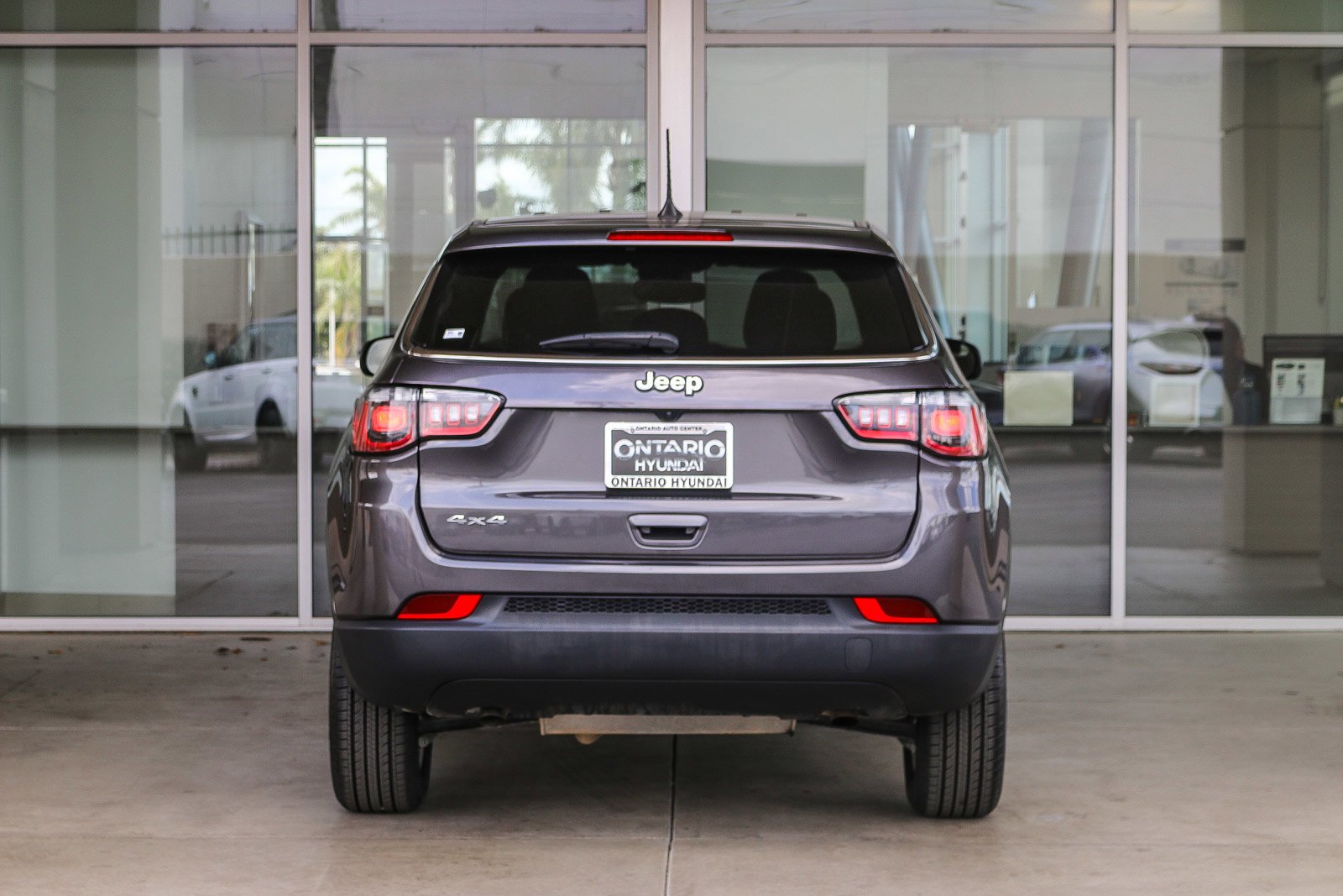 Used 2023 Granite Crystal Metallic Clearcoat Jeep Sport image 7