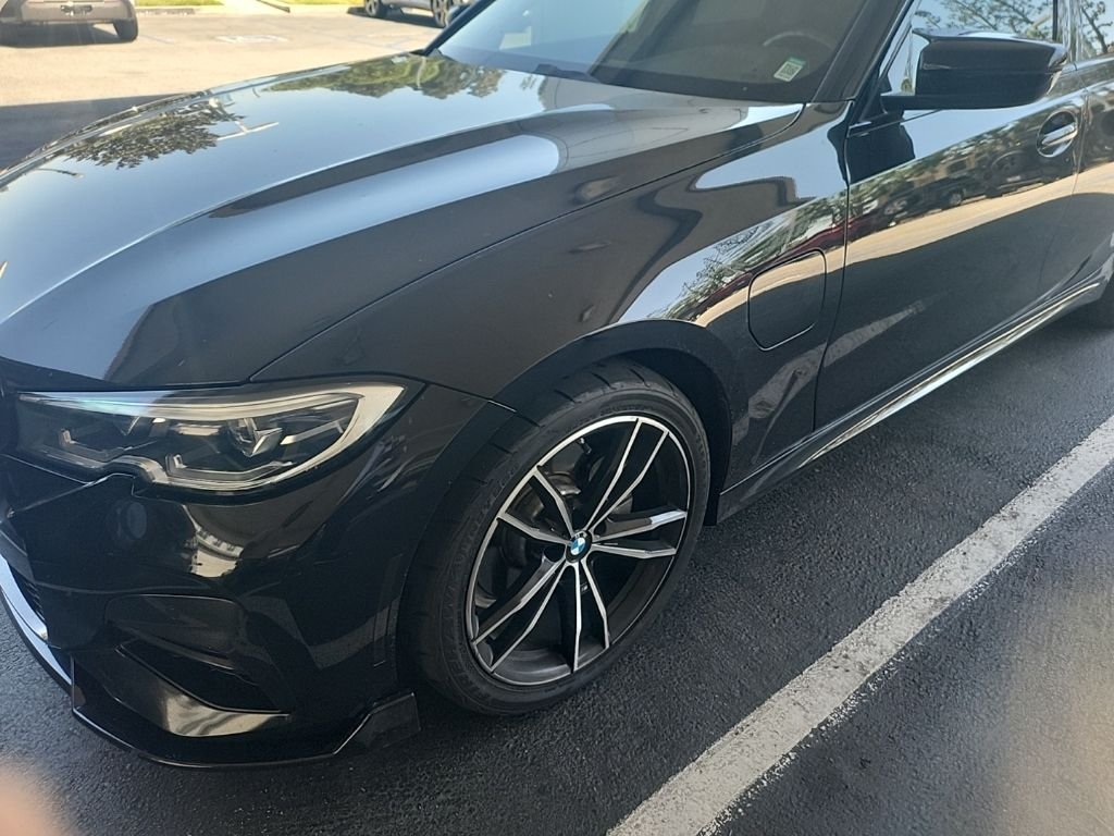 Used 2021 Black Sapphire Metallic BMW 330e iPerformance image 1
