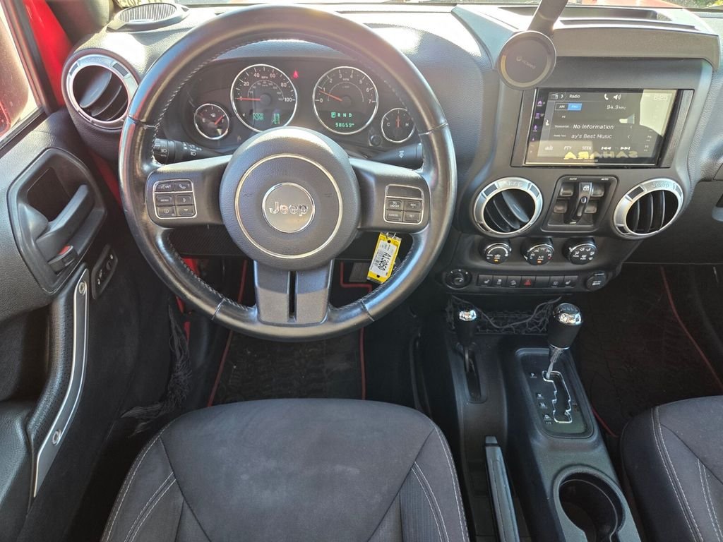 Used 2015 Red Jeep Unlimited Sahara image 13