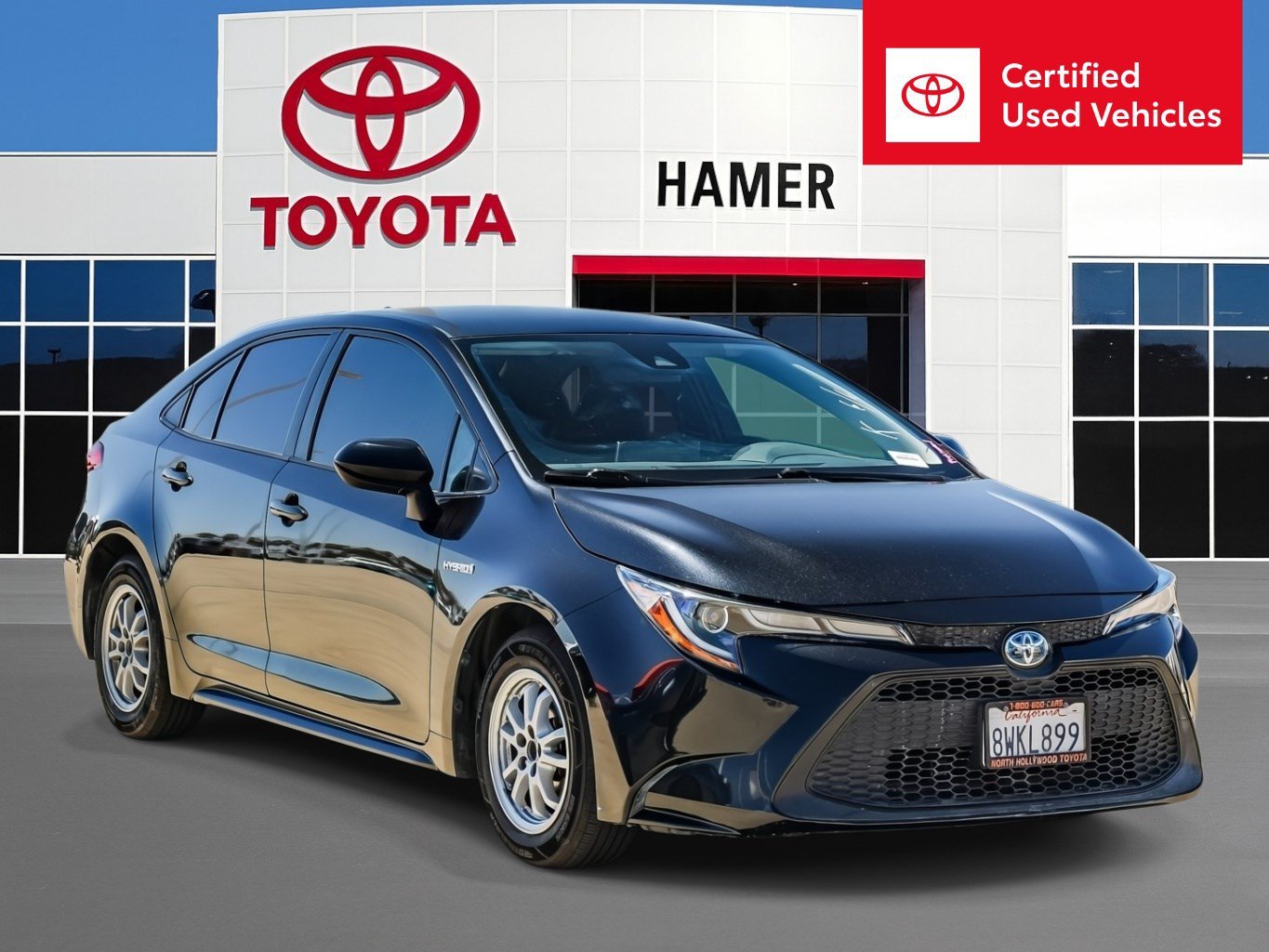 Used 2021 Black Sand Pearl Toyota Hybrid LE image 1