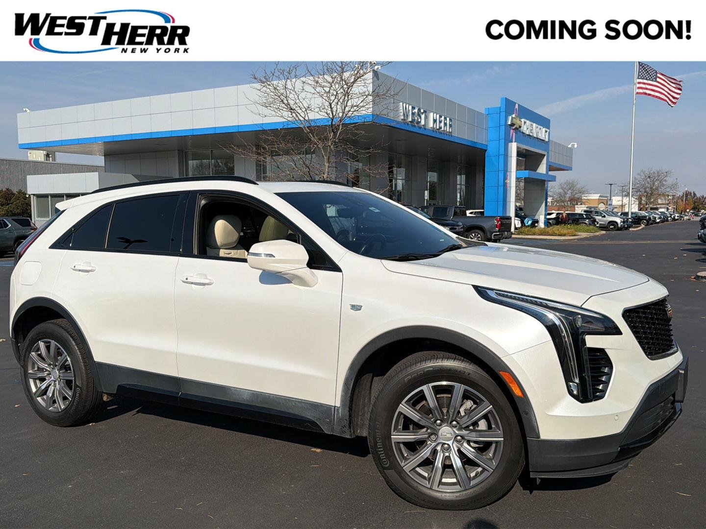 Used 2022 Crystal White Tricoat Cadillac AWD Sport image 1
