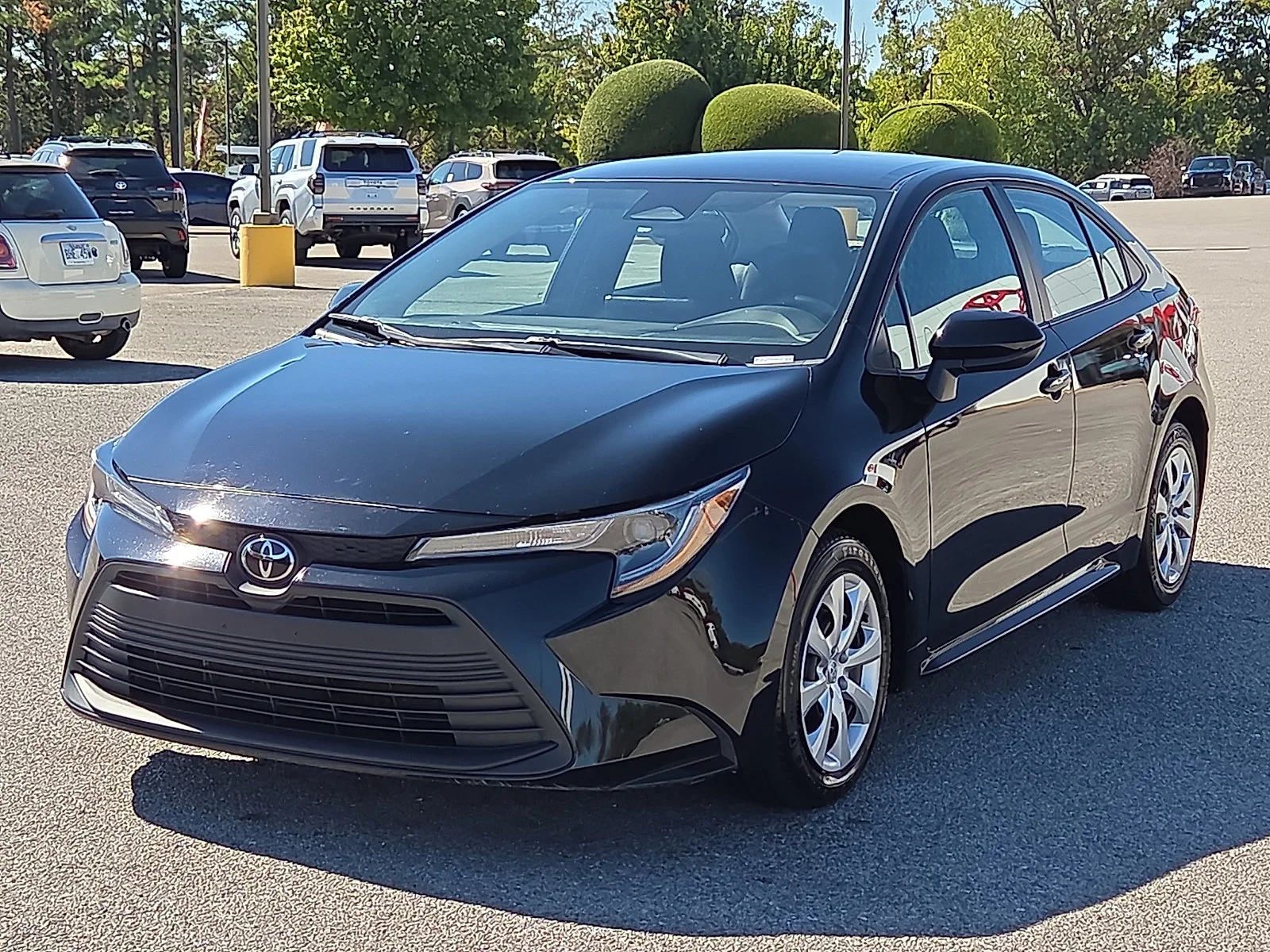 Used 2025 Midnight Black Metallic Toyota LE image 2