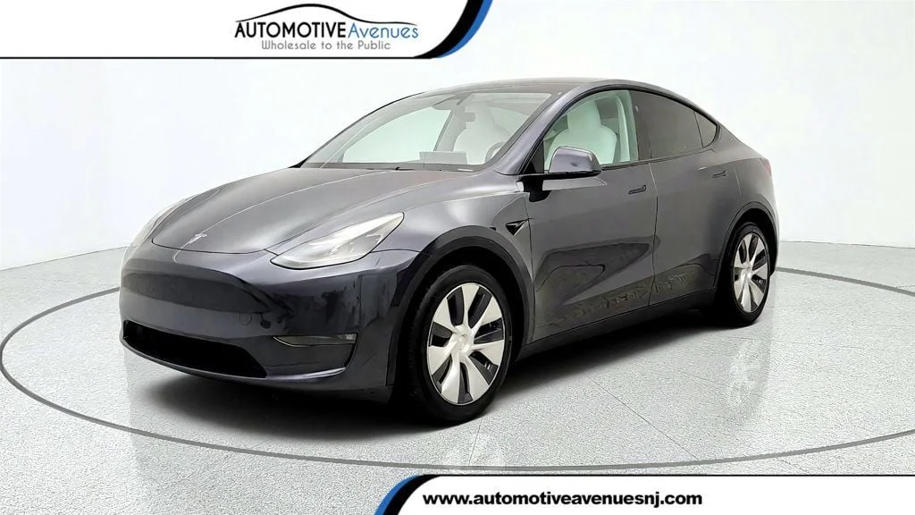 Used 2024 Stealth Grey Tesla Long Range AWD w/ 7-Seat White & Black Premium Interior image 1