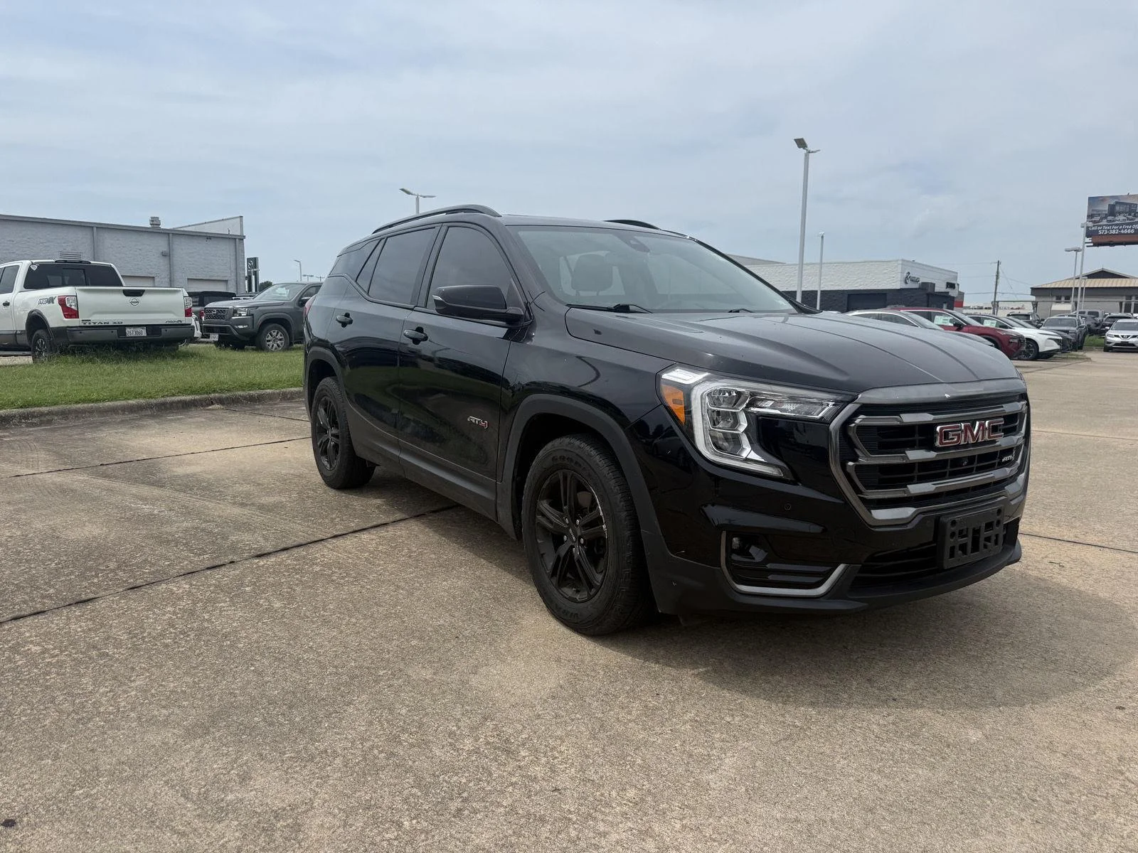 Used 2022 Ebony Twilight Metallic GMC AT4 image 1