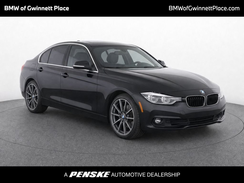 Used 2018 Jet Black BMW 330i xDrive image 1