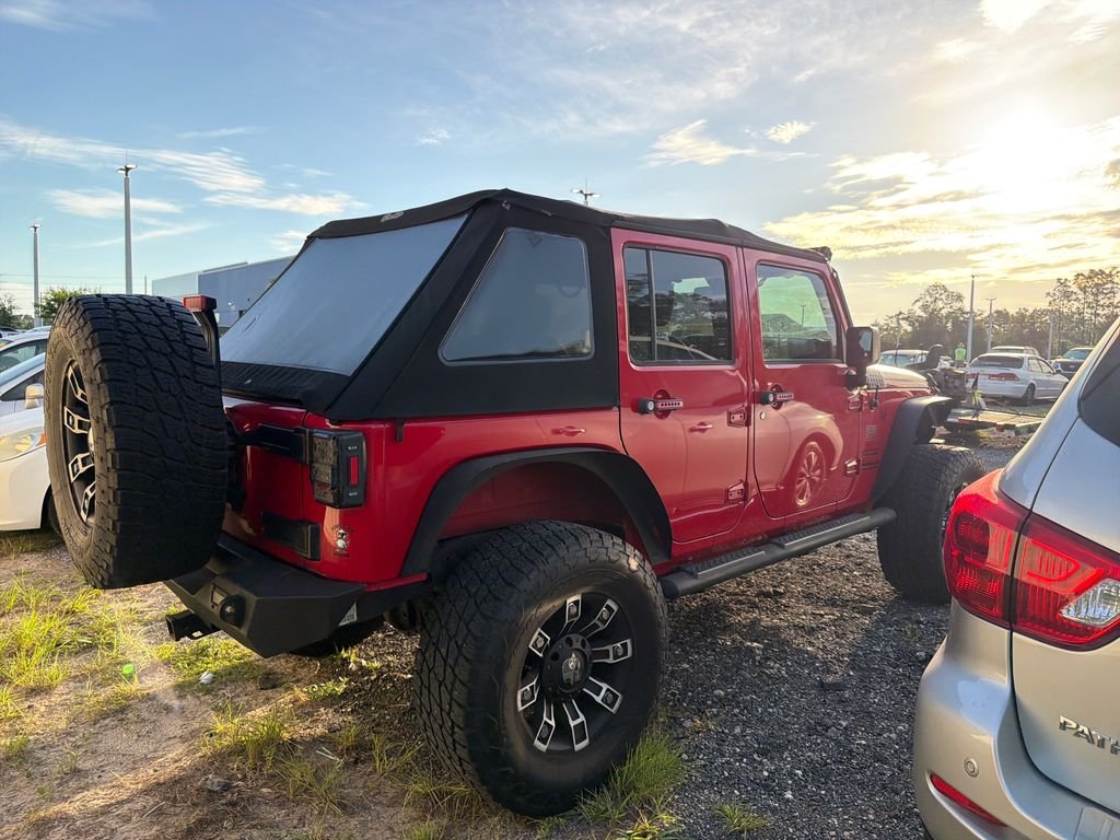 Used 2015 Red Jeep Unlimited Sport image 5