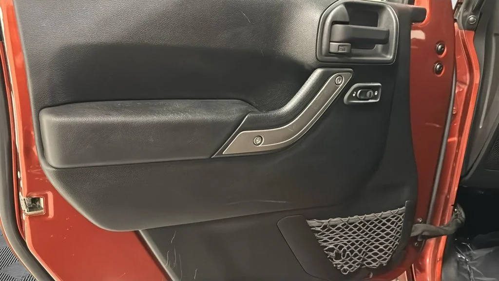 Used 2014 Orange Jeep Unlimited Sport image 18