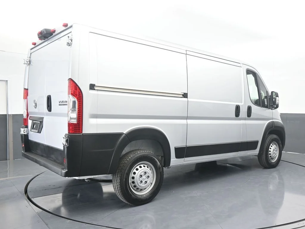 Used 2025 Bright Silver Clearcoat Metallic Ram Low Roof image 6