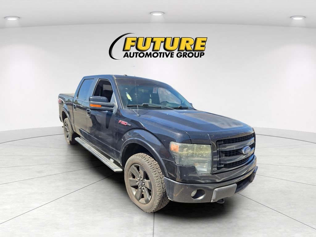 Used 2013 Black Ford FX4 image 1