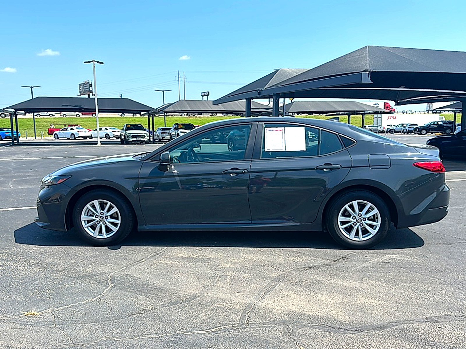 Used 2025 Super Black Toyota LE image 5