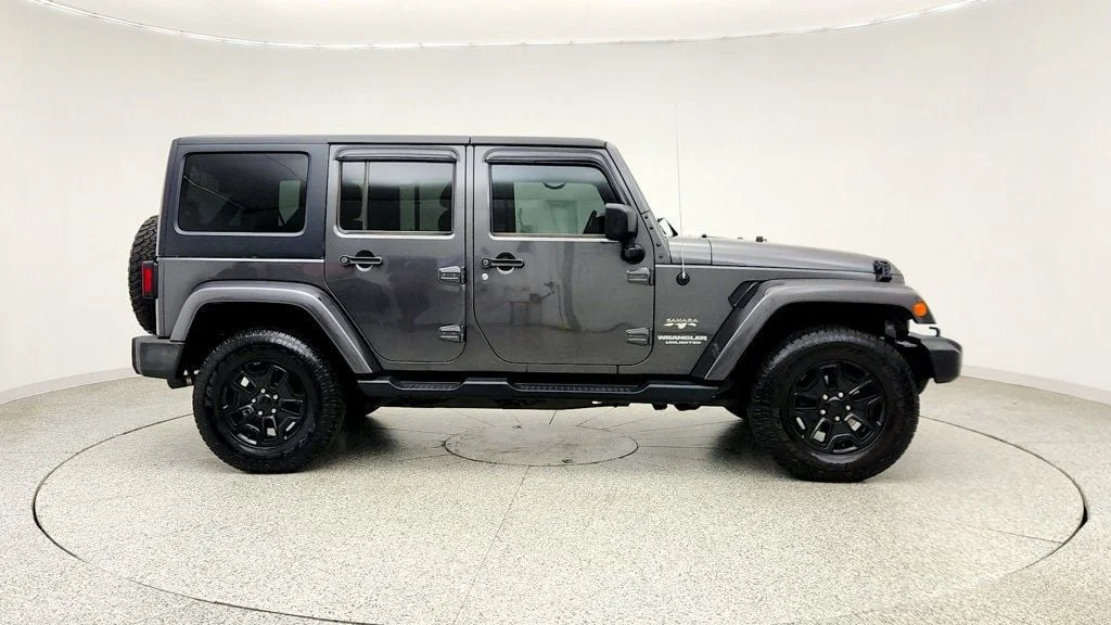 Used 2017 Granite Crystal Metallic Clearcoat Jeep Sahara 4x4 w/ Heated Seats, Remote Start & Connectivity Pkg image 4