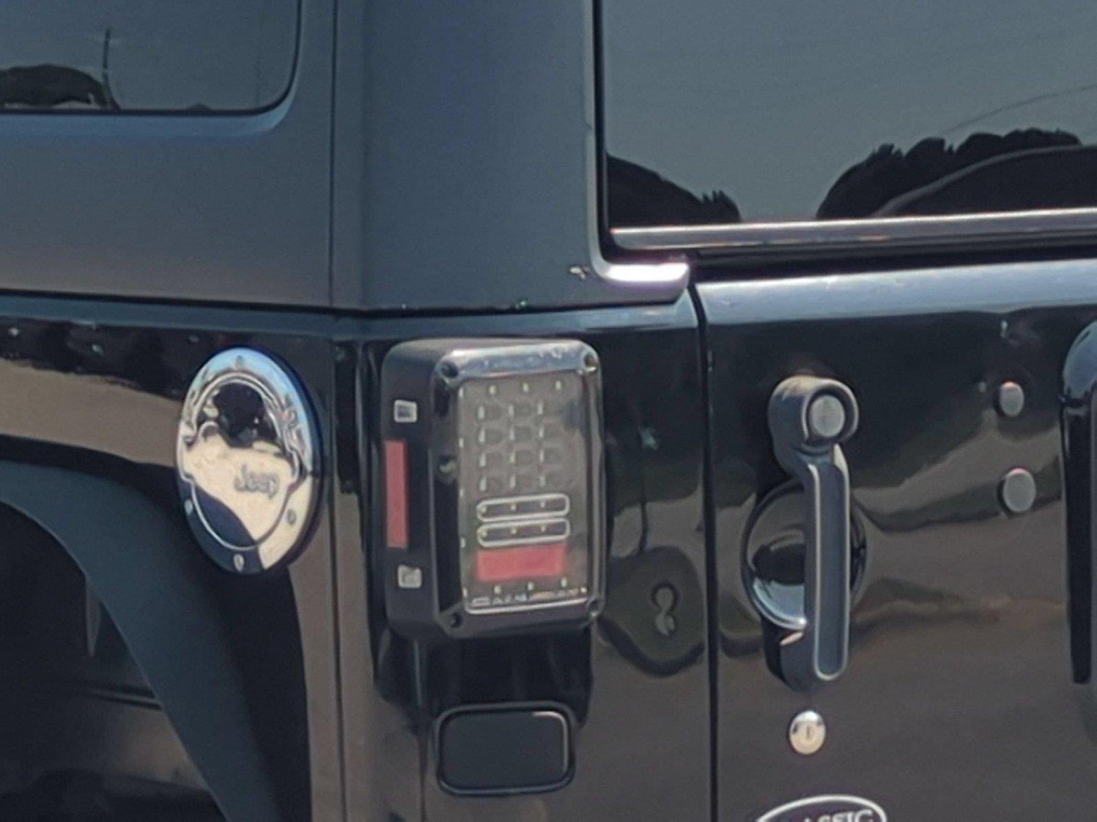 Used 2012 Black Clearcoat Jeep Sahara image 11