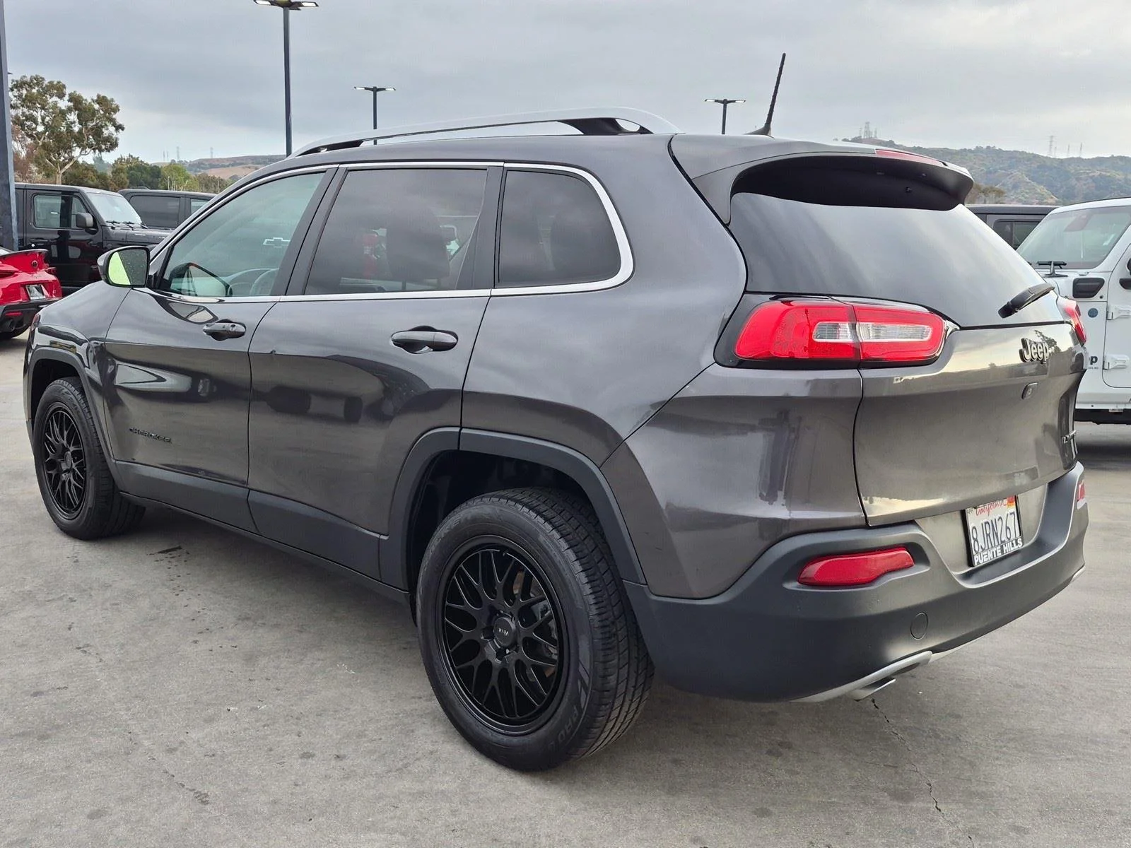 Used 2016 Granite Crystal Metallic Clearcoat Jeep Limited image 4