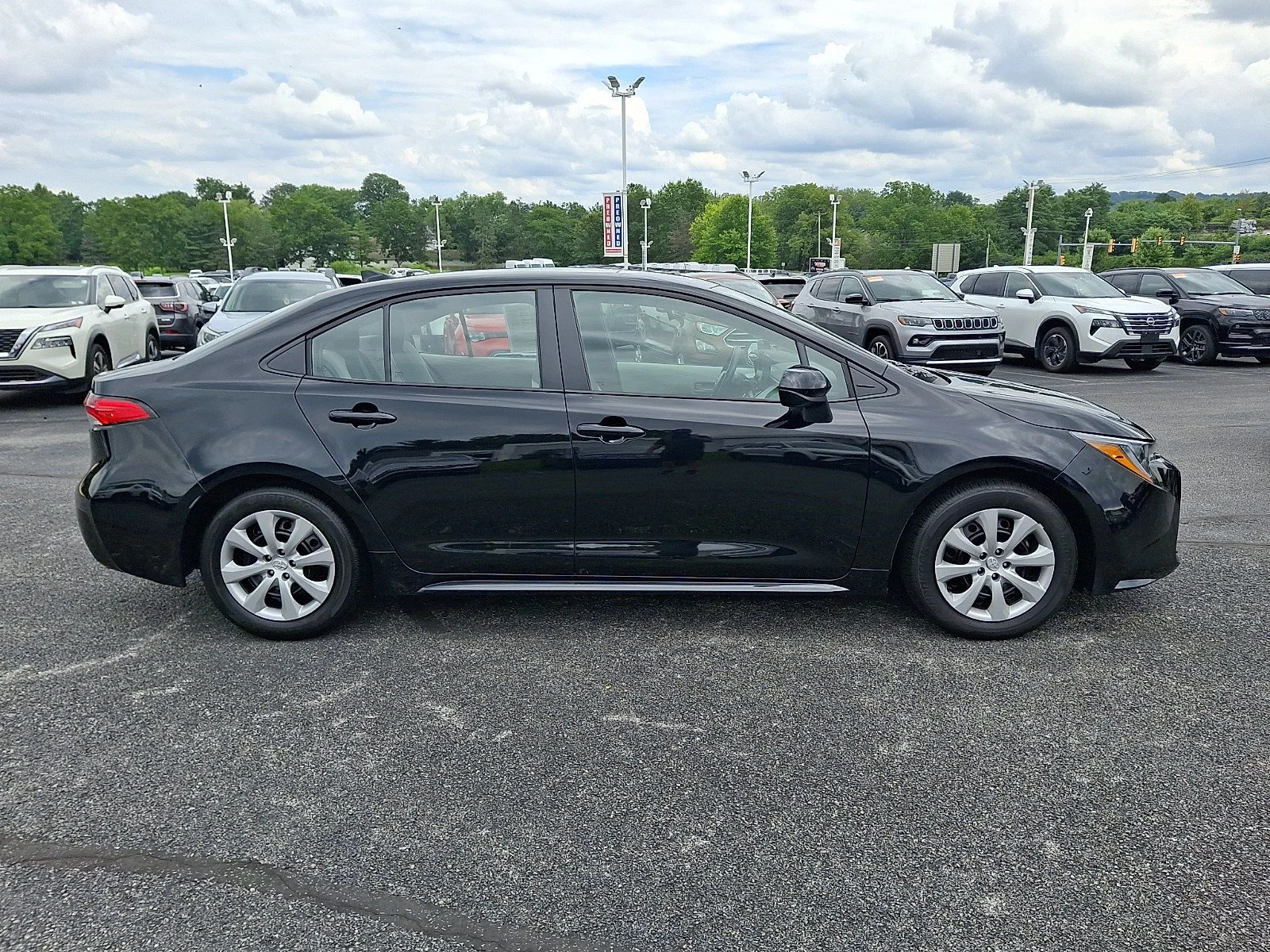 Used 2025 Midnight Black Metallic   218 Toyota LE image 8