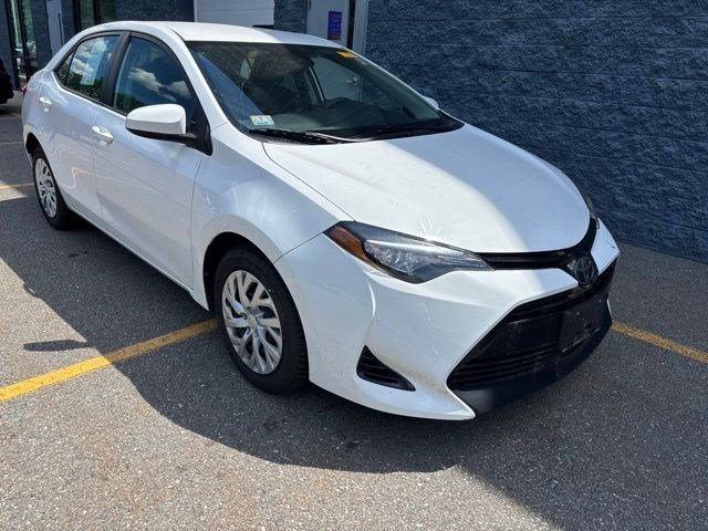 Used 2017 Super White Toyota LE image 1