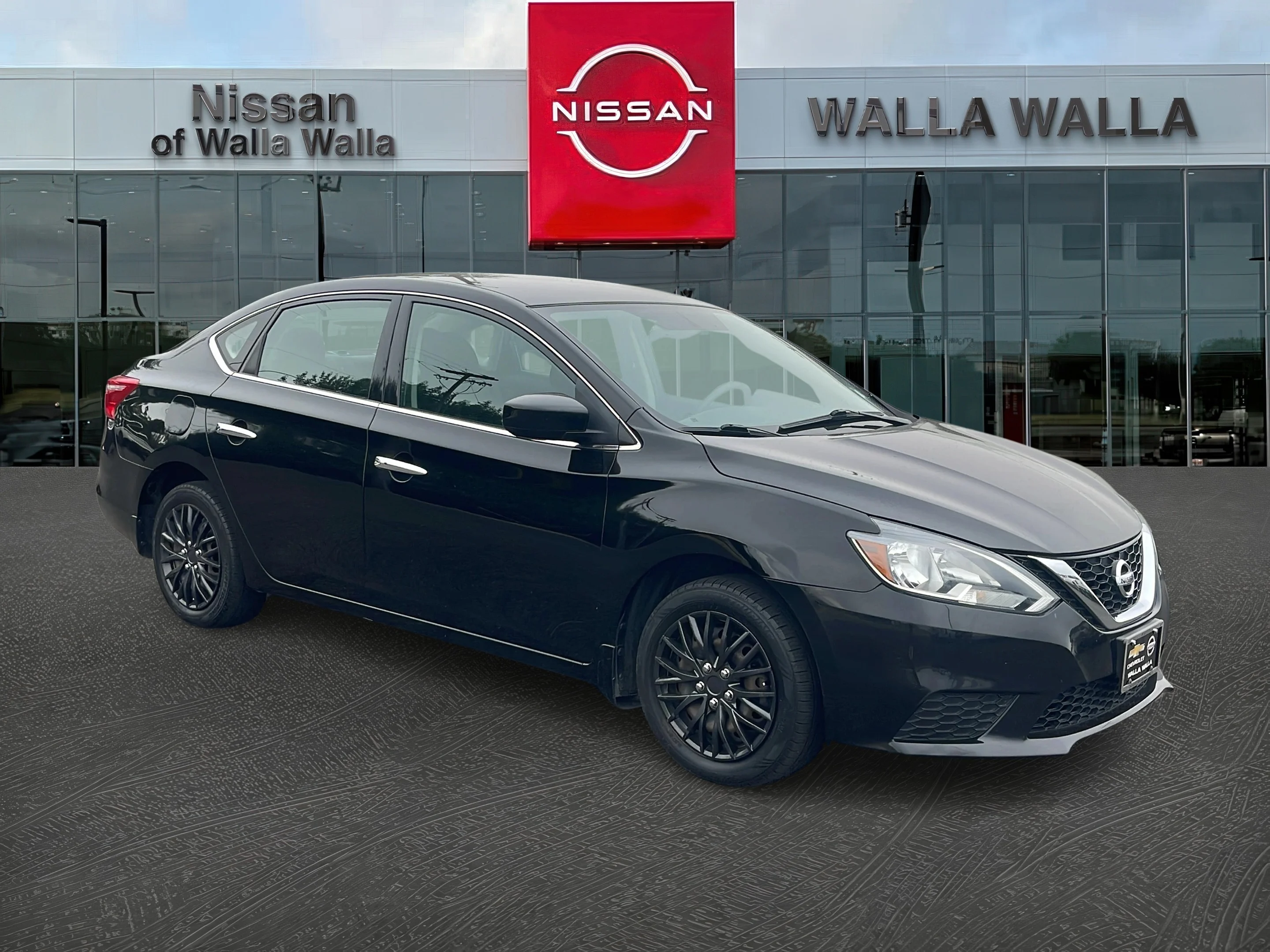 Used 2017 Super Black Nissan SV image 1
