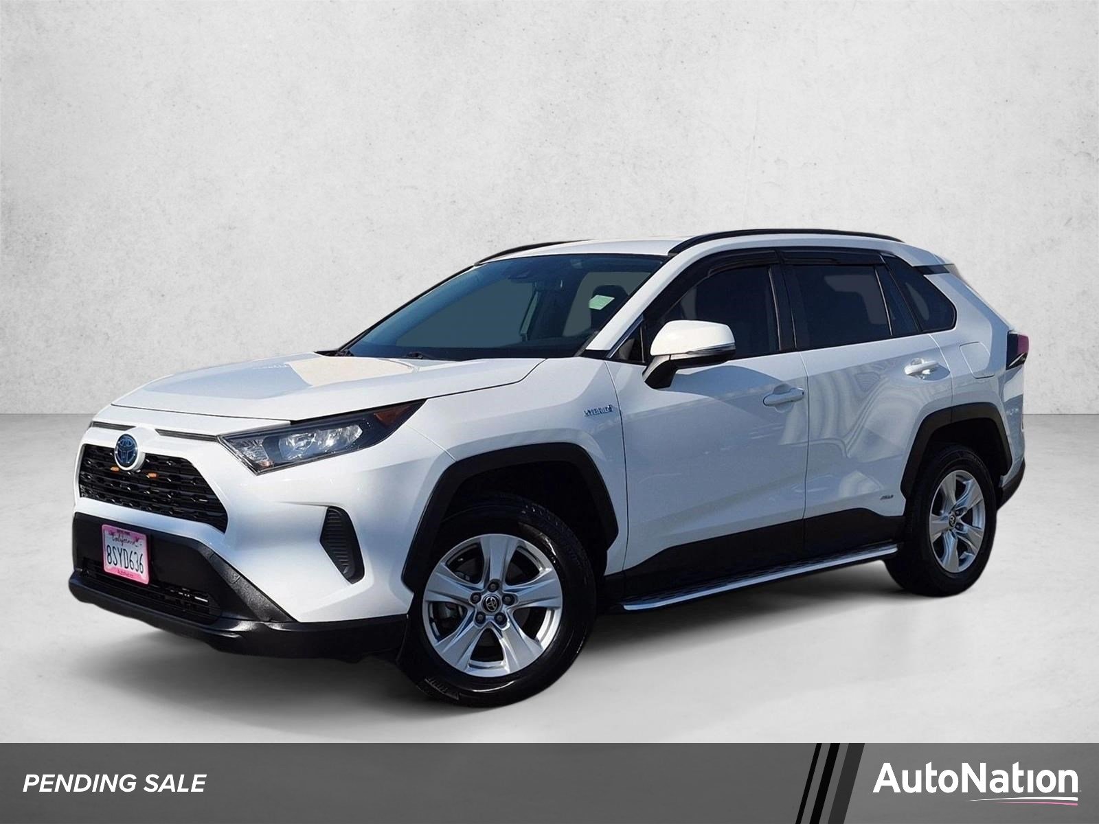 Used 2021 Super White Toyota Hybrid LE image 1