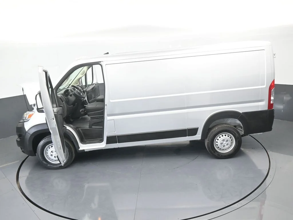 Used 2025 Bright Silver Clearcoat Metallic Ram Low Roof image 56