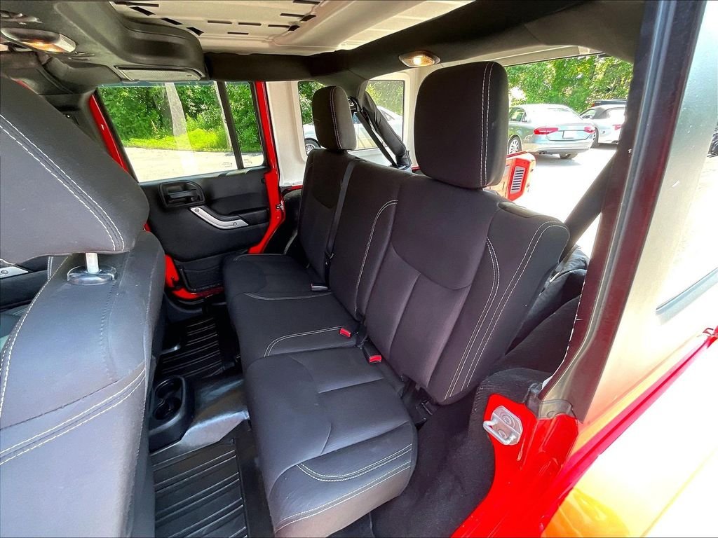 Used 2015 Red Jeep Unlimited Sahara image 24