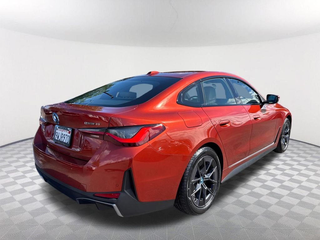 Certified Used 2023 Sunset Orange Metallic BMW eDrive35 image 4