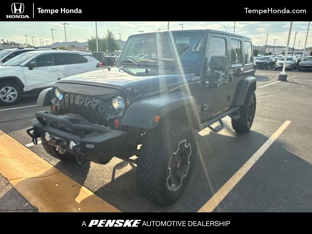 Used 2011 Black ClearCoat Jeep Unlimited Rubicon image 1