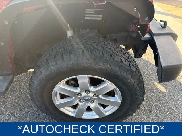 Used 2013 Red Jeep Unlimited Sahara image 2