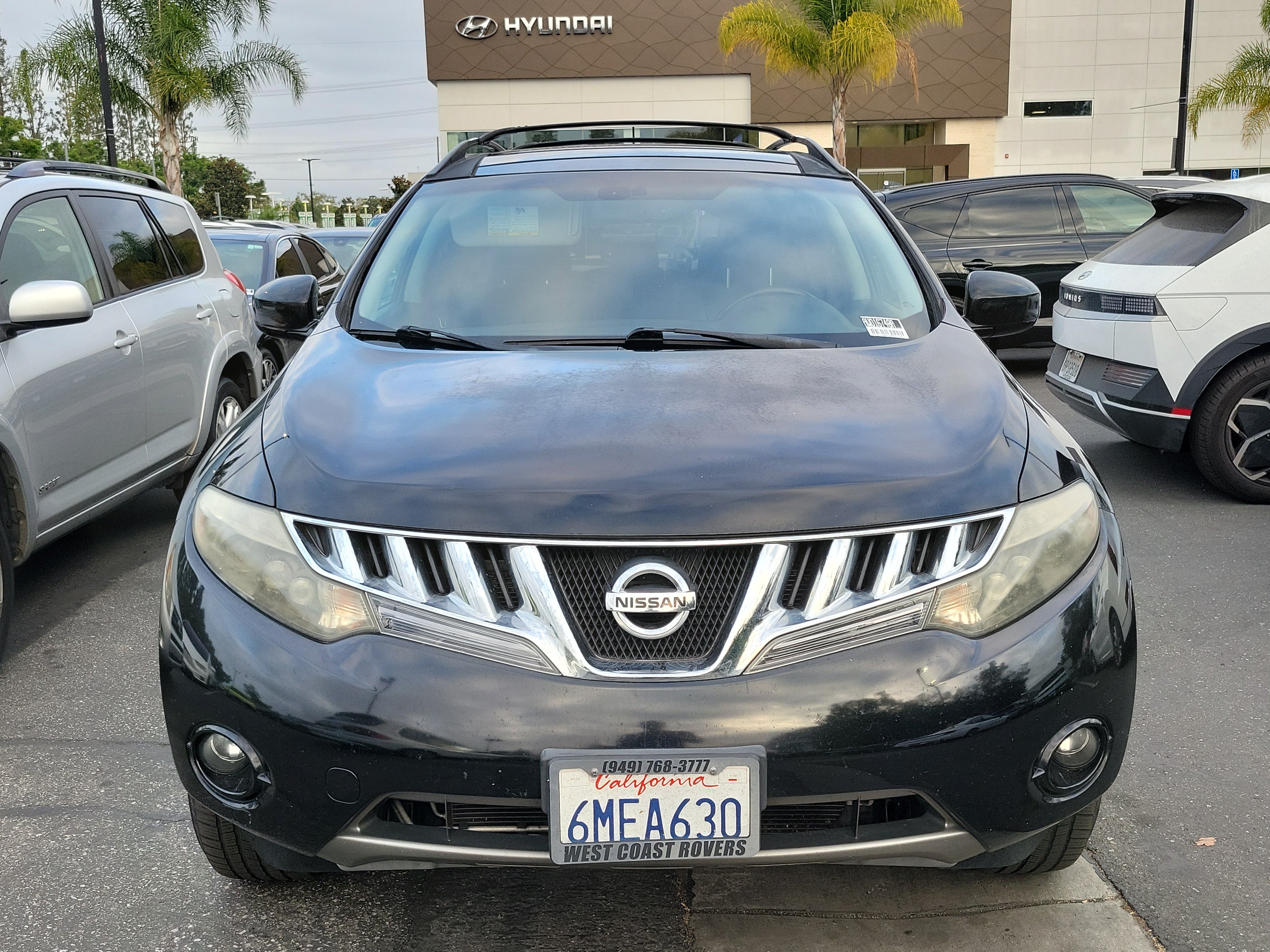 Used 2010 Super Black Nissan SL image 2