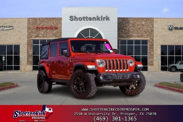 Used 2018 Red Jeep Unlimited Sahara image 1