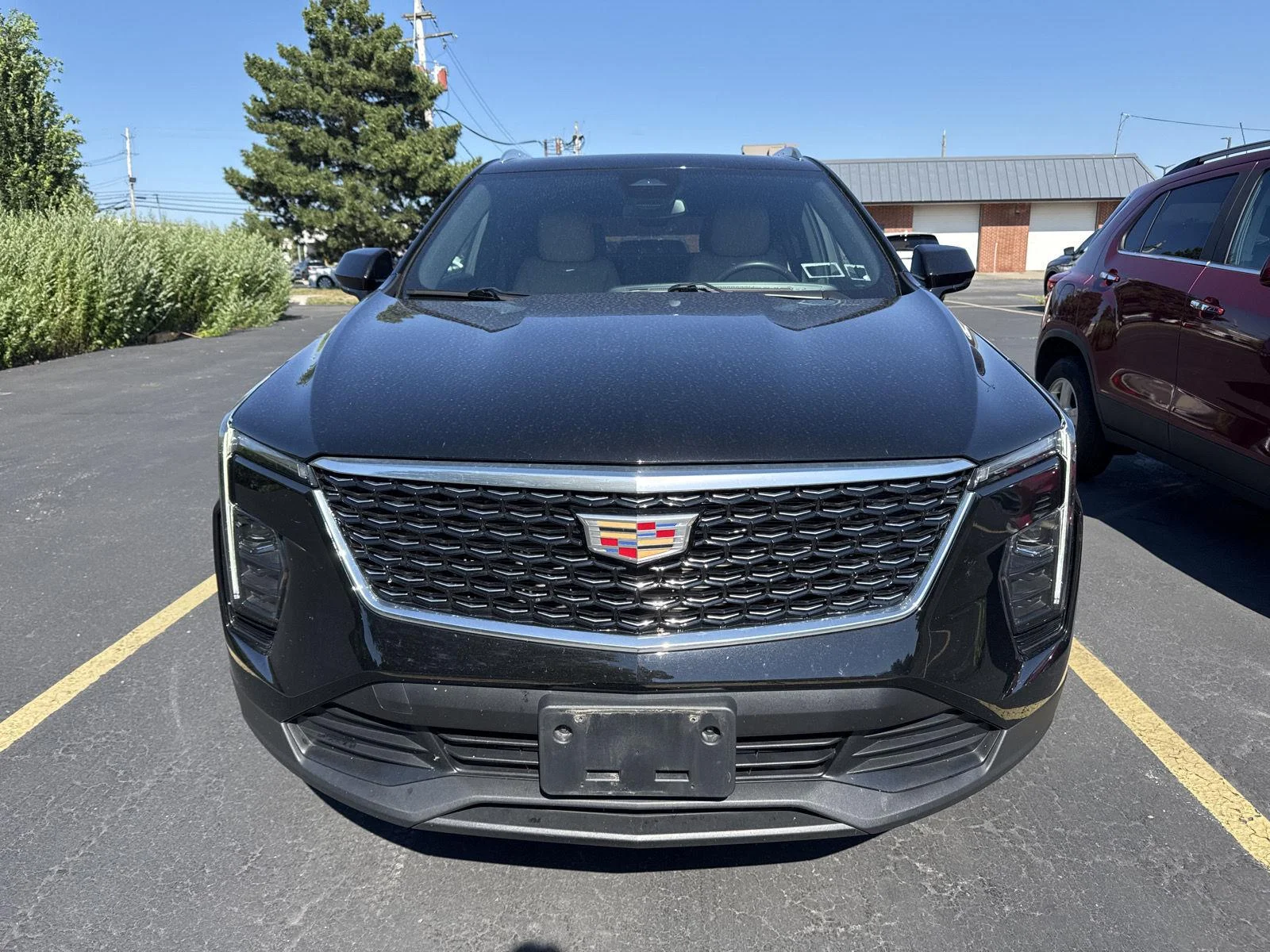 Used 2024 Stellar Black Metallic Cadillac AWD Luxury image 2