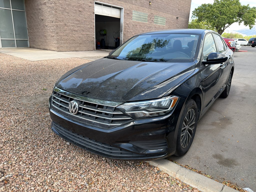 Used 2021 Black Uni Volkswagen SE image 1