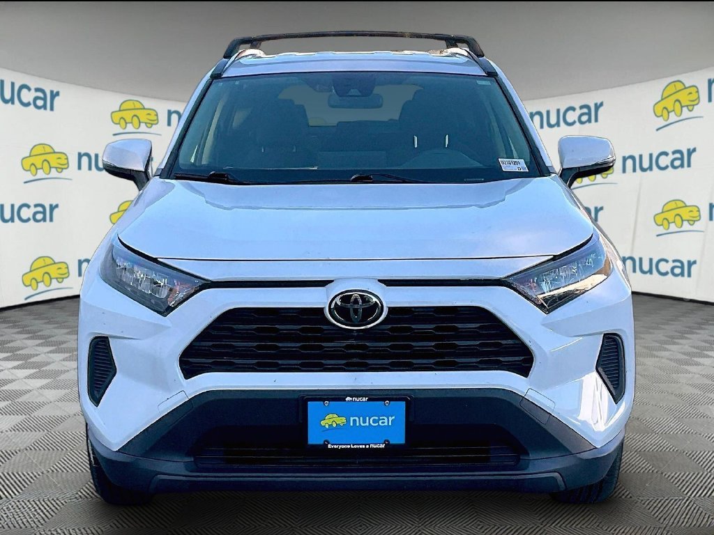 Used 2021 Super White Toyota LE image 2