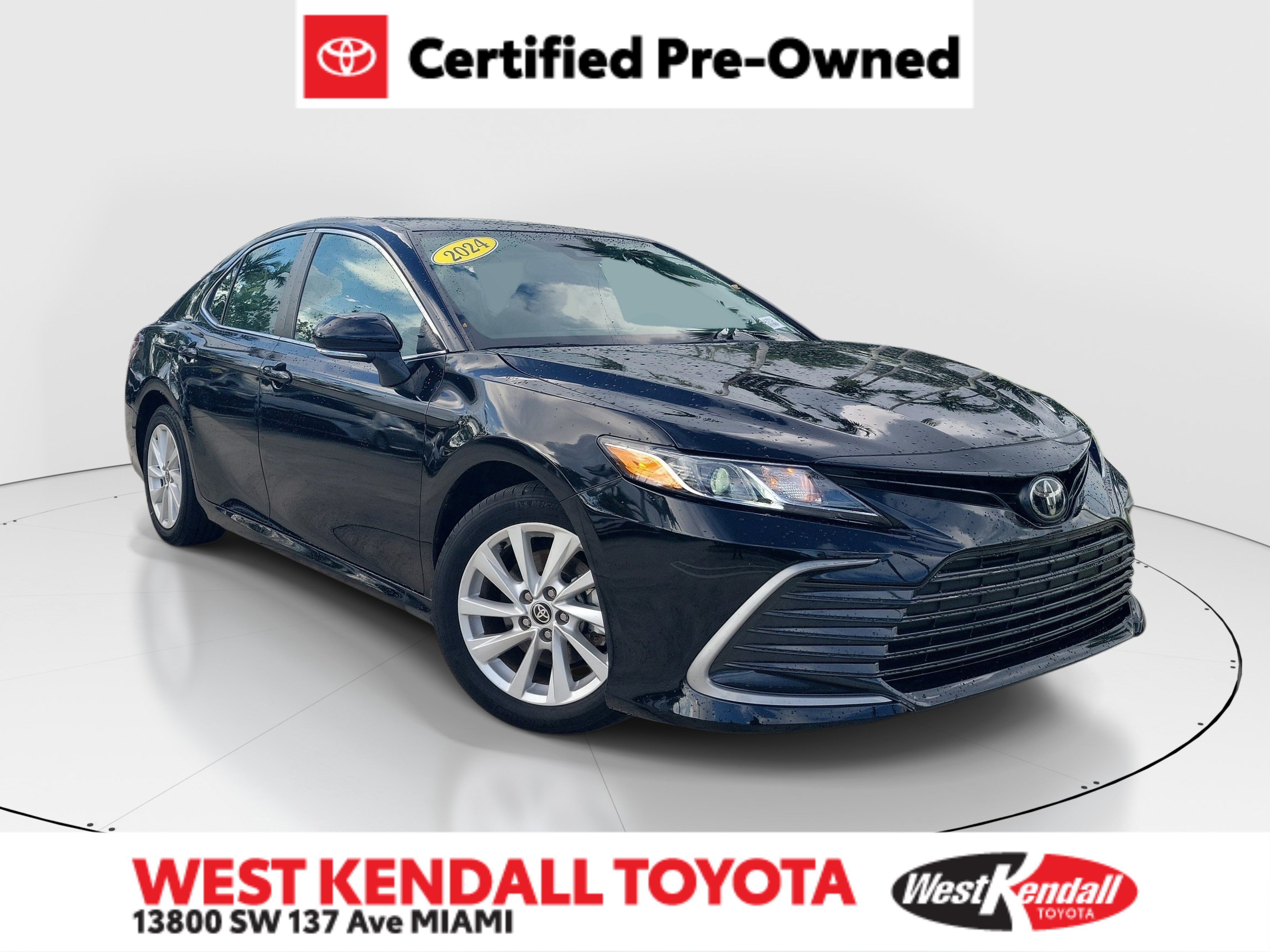Used 2024 Midnight Black Metallic Toyota LE image 1