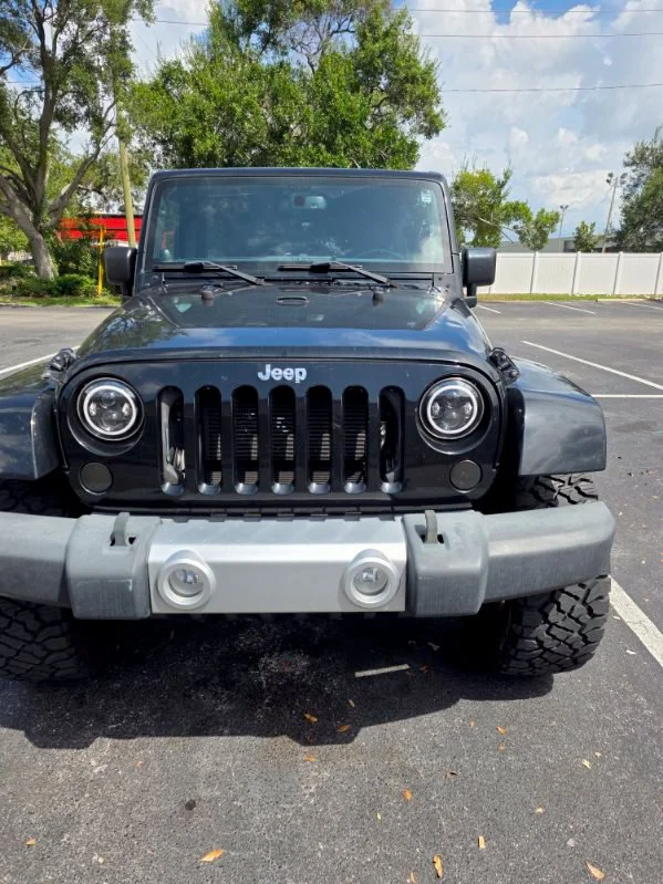 Used 2014 Black Jeep Unlimited Sahara image 2